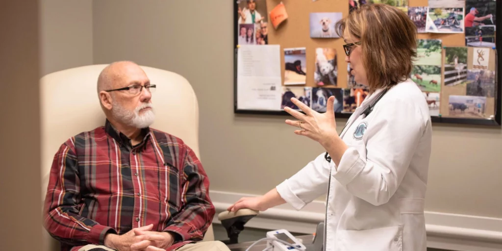 Dr. Heather Hutchings talking with patient at Limb Preservation Center of East Tennessee