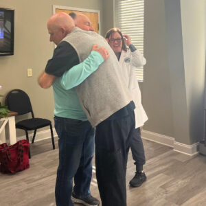 Hyperbaric oxygen therapy patient hugging Kelly Maddox, LPN, WCC