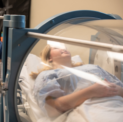 patient undergoing traditional hyperbaric oxygen therapy rather than mild hyperbaric oxygen therapy